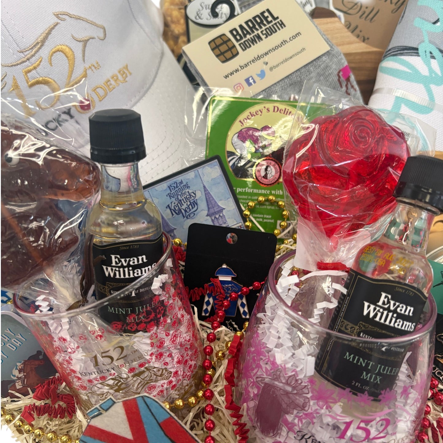 Kentucky Derby 152 cap, Jockey’s Delite chocolates, party beads, and commemorative glasses with party favors.