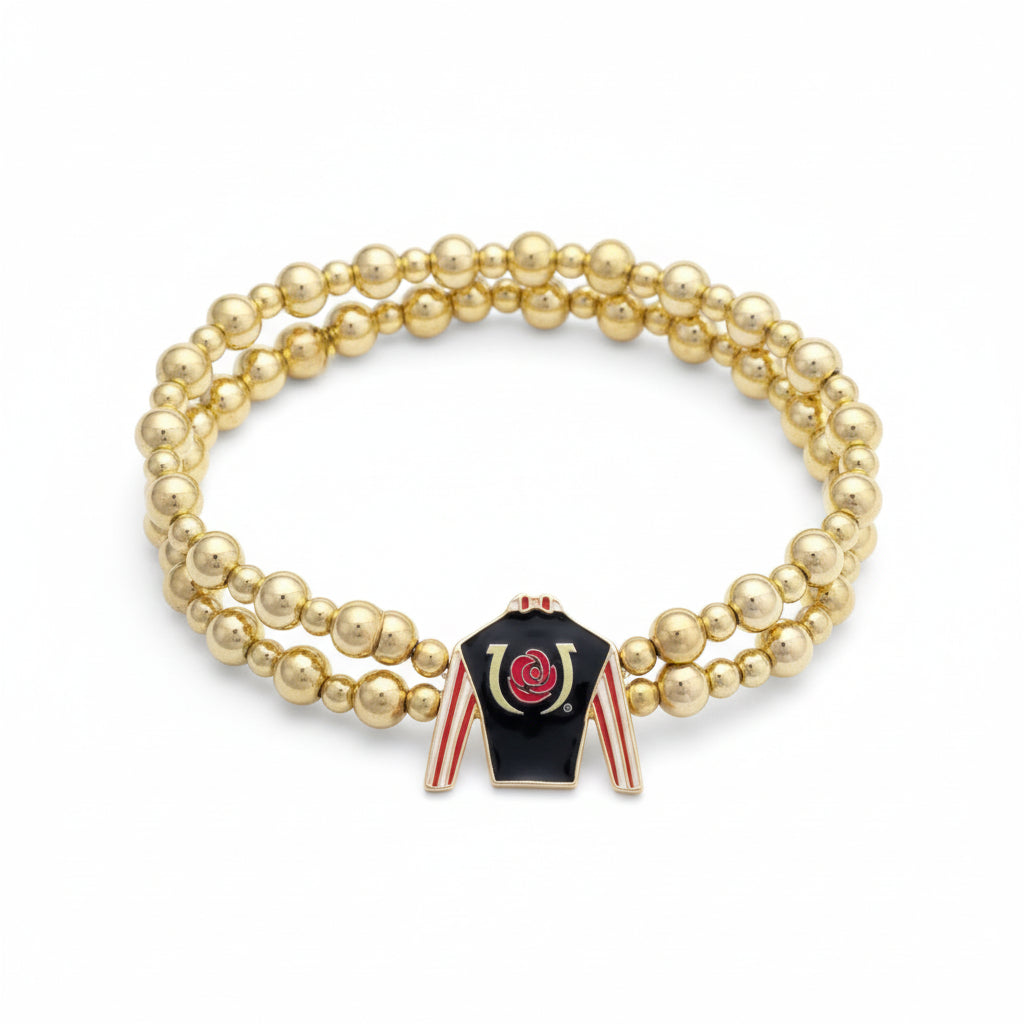 Full view of the Kentucky Derby two-row gold bead stretch bracelet, showcasing the black, red, and white jockey silk enamel charm.