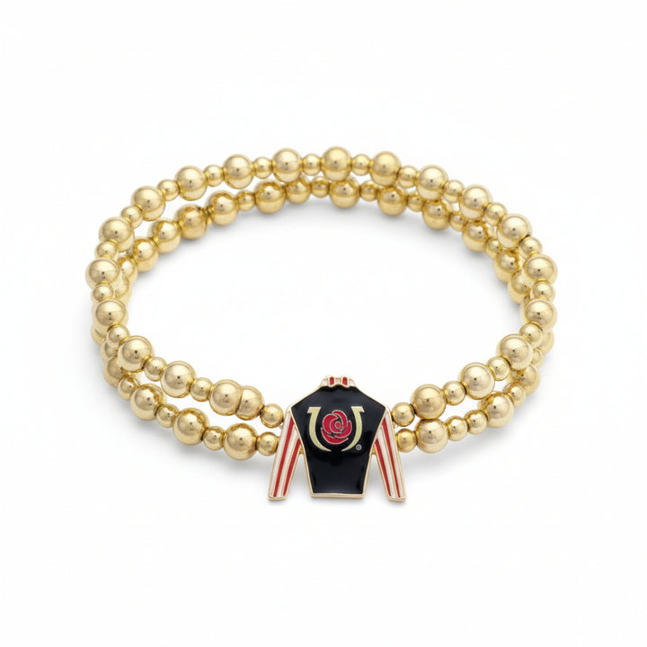 Full view of the Kentucky Derby two-row gold bead stretch bracelet, showcasing the black, red, and white jockey silk enamel charm.