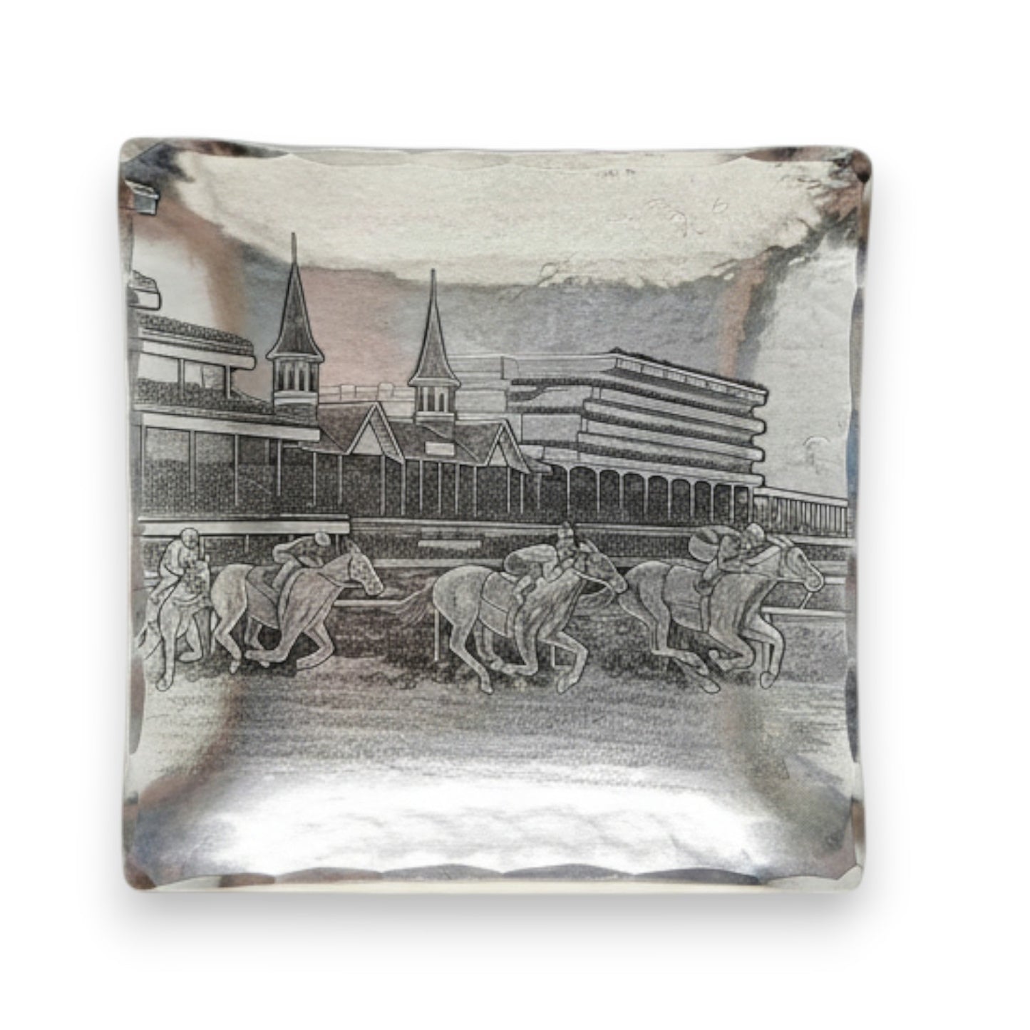 The handcrafted aluminum Kentucky Derby Canape Tray showcasing the intricate design of running horses and the Churchill Downs Twin Spires.