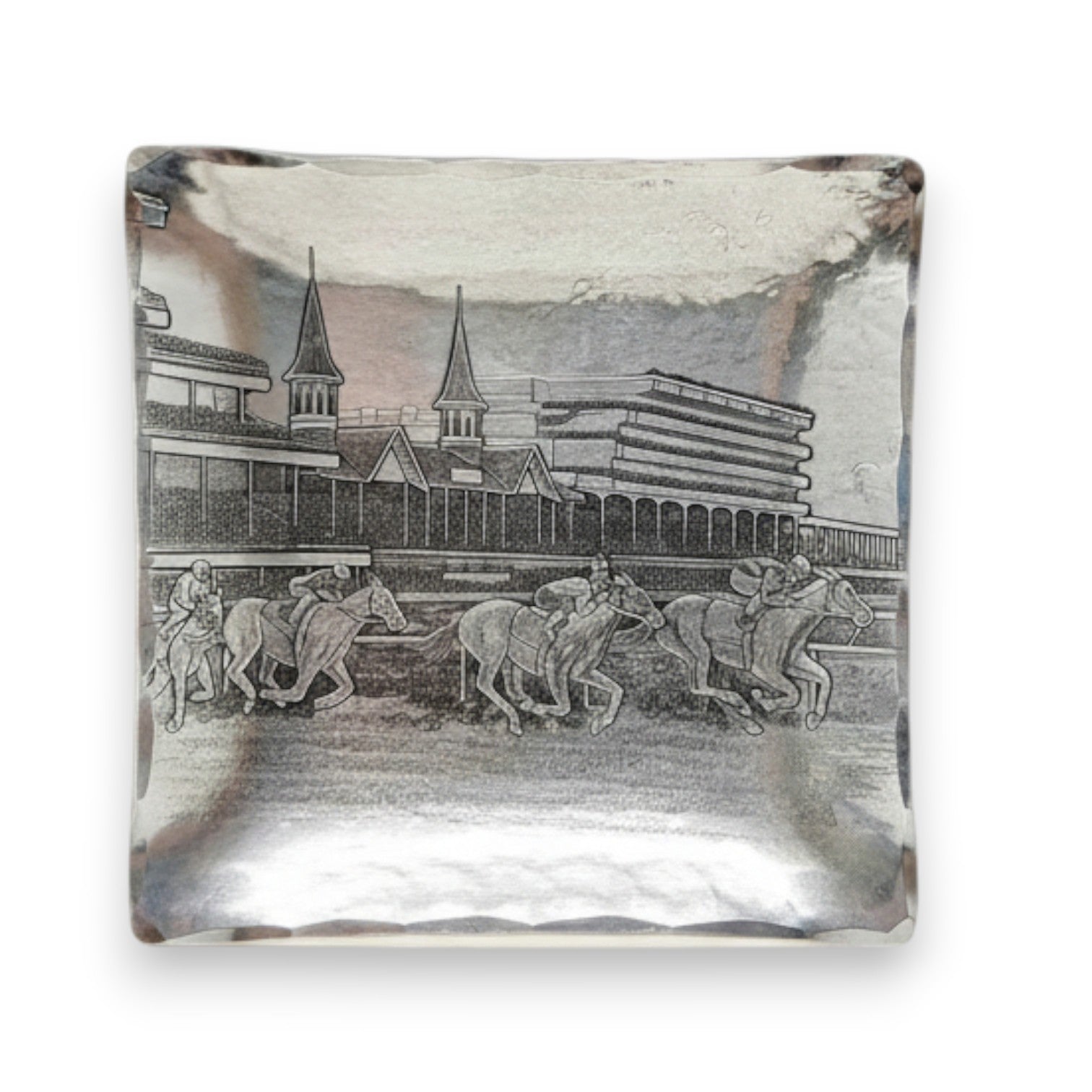 The handcrafted aluminum Kentucky Derby Canape Tray showcasing the intricate design of running horses and the Churchill Downs Twin Spires.
