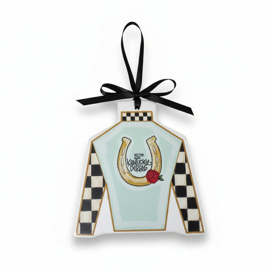 The 5" x 5" flat ceramic Kentucky Derby ornament shaped like a jockey silk with a black hanging ribbon.