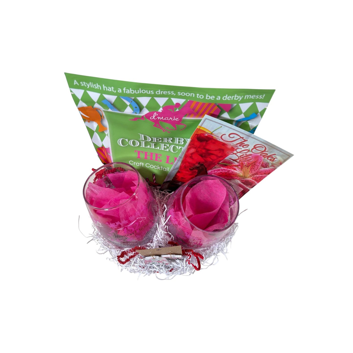 A vibrant pink and lime green Kentucky Oaks gift basket in a round wooden base featuring cocktail mix, commemorative glasses, and lily earrings.