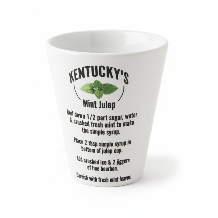A classic white ceramic julep cup featuring the "Kentucky's Mint Julep" title and full recipe printed in black text.