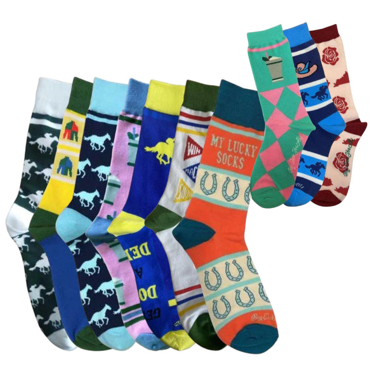 A group of colorful novelty socks arranged in two overlapping rows on a plain white background. The socks feature various designs including horse silhouettes, horseshoes, roses, and text such as 'MY LUCKY SOCKS'.
