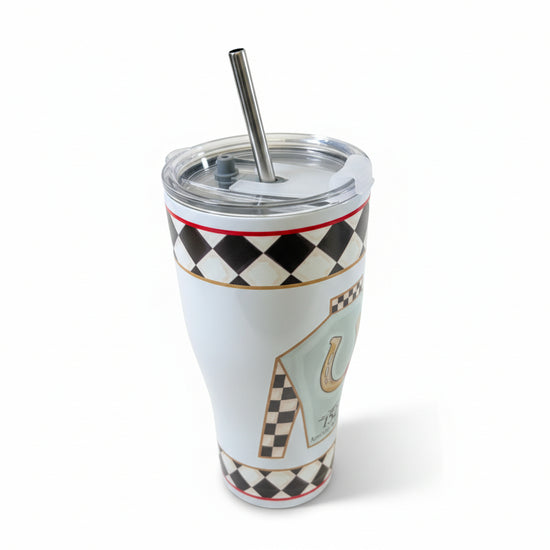 A close-up of the stainless steel tumbler, showing the clear lid, metal straw, and detailed black and white checkerboard pattern.