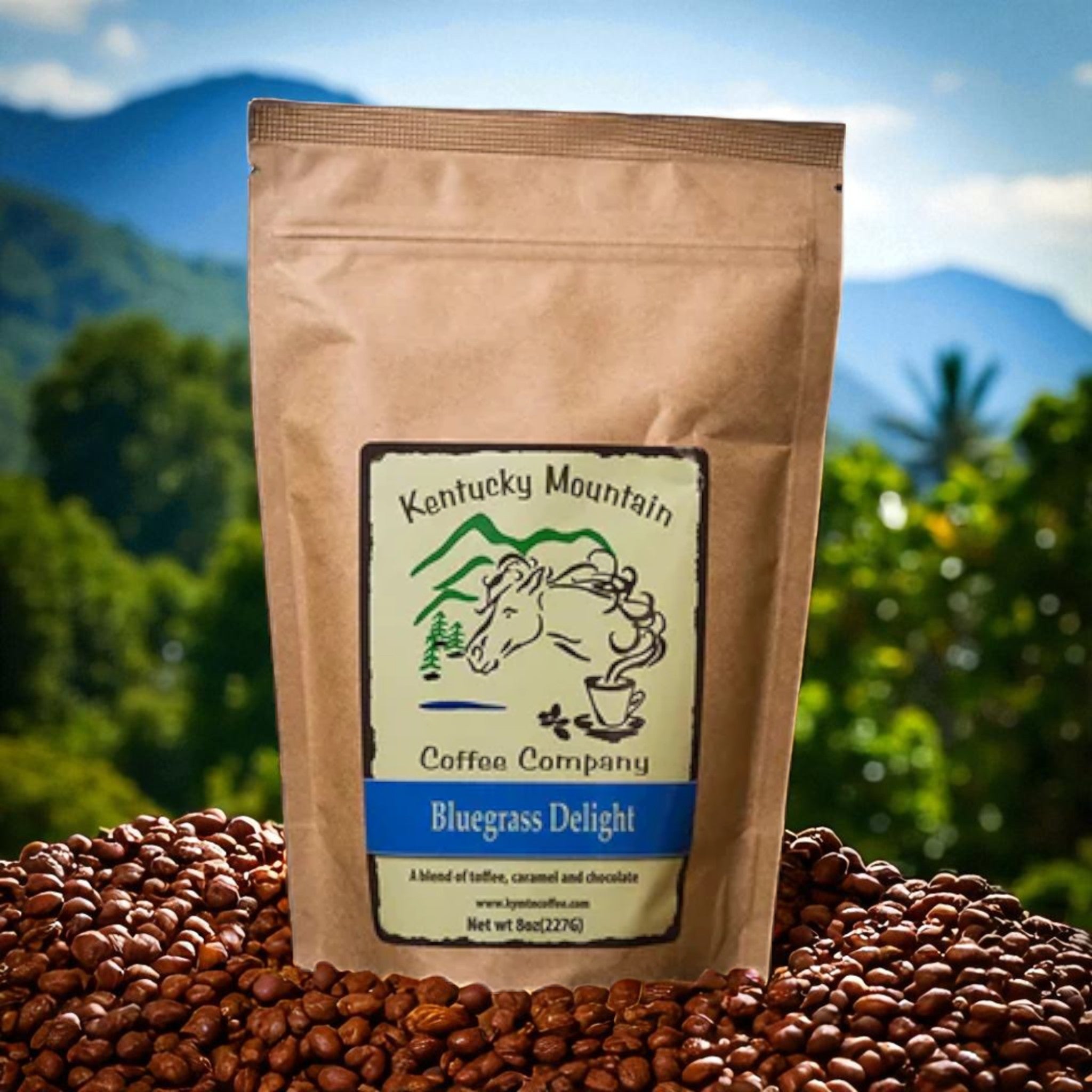Kraft paper coffee bag with 'Kentucky Mountain Coffee Company' label on a bed of coffee beans with a mountainous background.