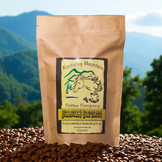 Kentucky Mountain Coffee Company bag with coffee beans in front and mountains in the background