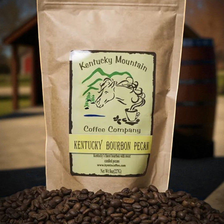 Coffee bag from Kentucky Mountain Coffee Company with coffee beans in front