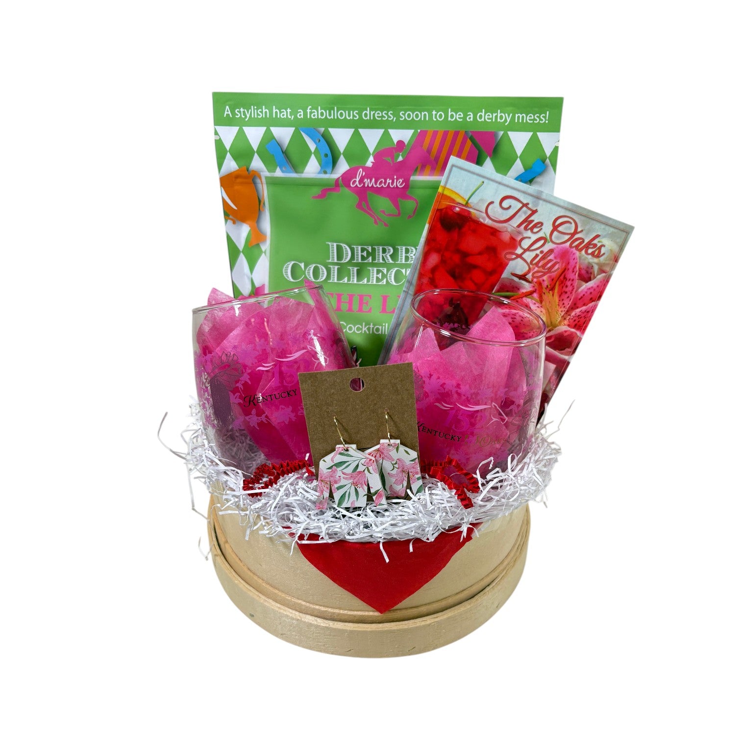 A vibrant pink and lime green Kentucky Oaks gift basket in a round wooden base featuring cocktail mix, commemorative glasses, and lily earrings.