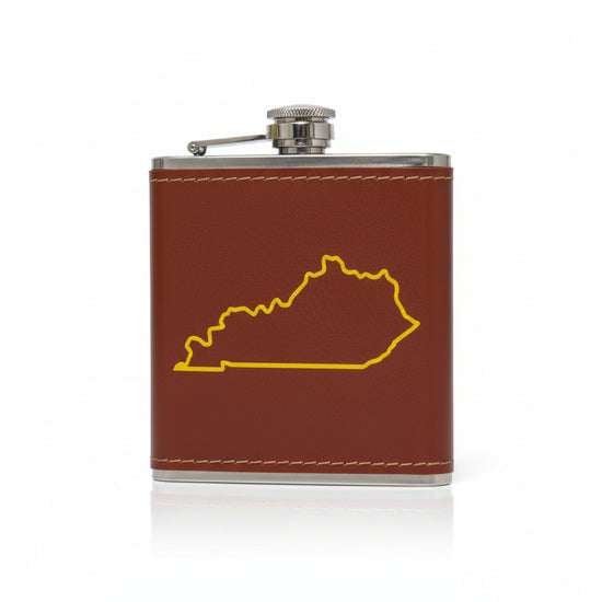 A reddish-brown faux leather flask featuring a bold yellow outline of the state of Kentucky.