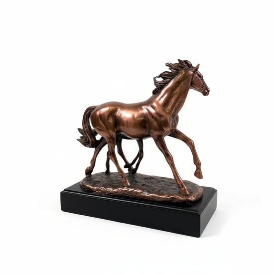 A close-up of the 10-inch wide copper sculpture, highlighting the sense of motion and the detailed craftsmanship of the running horses.