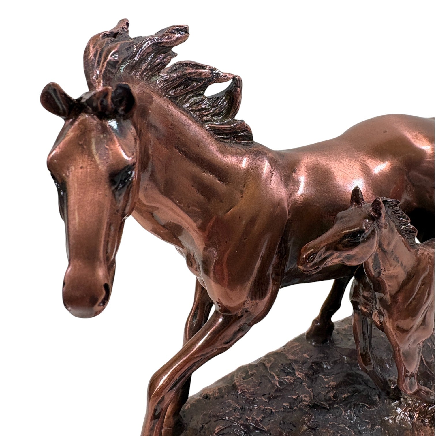 A close-up of the 10-inch wide copper sculpture, highlighting the sense of motion and the detailed craftsmanship of the running horses.