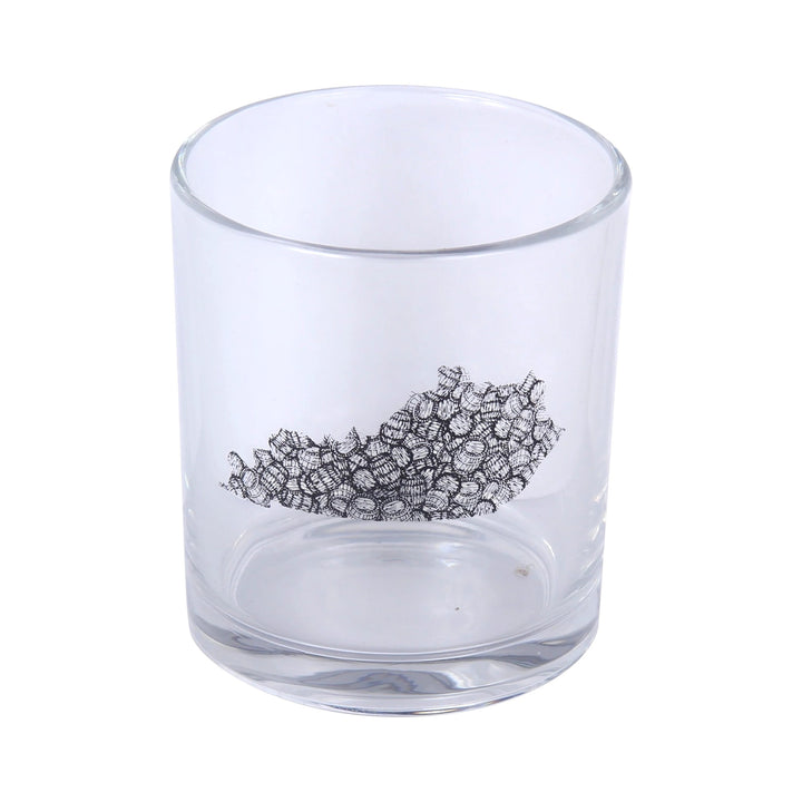 Clear glass tumbler with black coral design on a white background