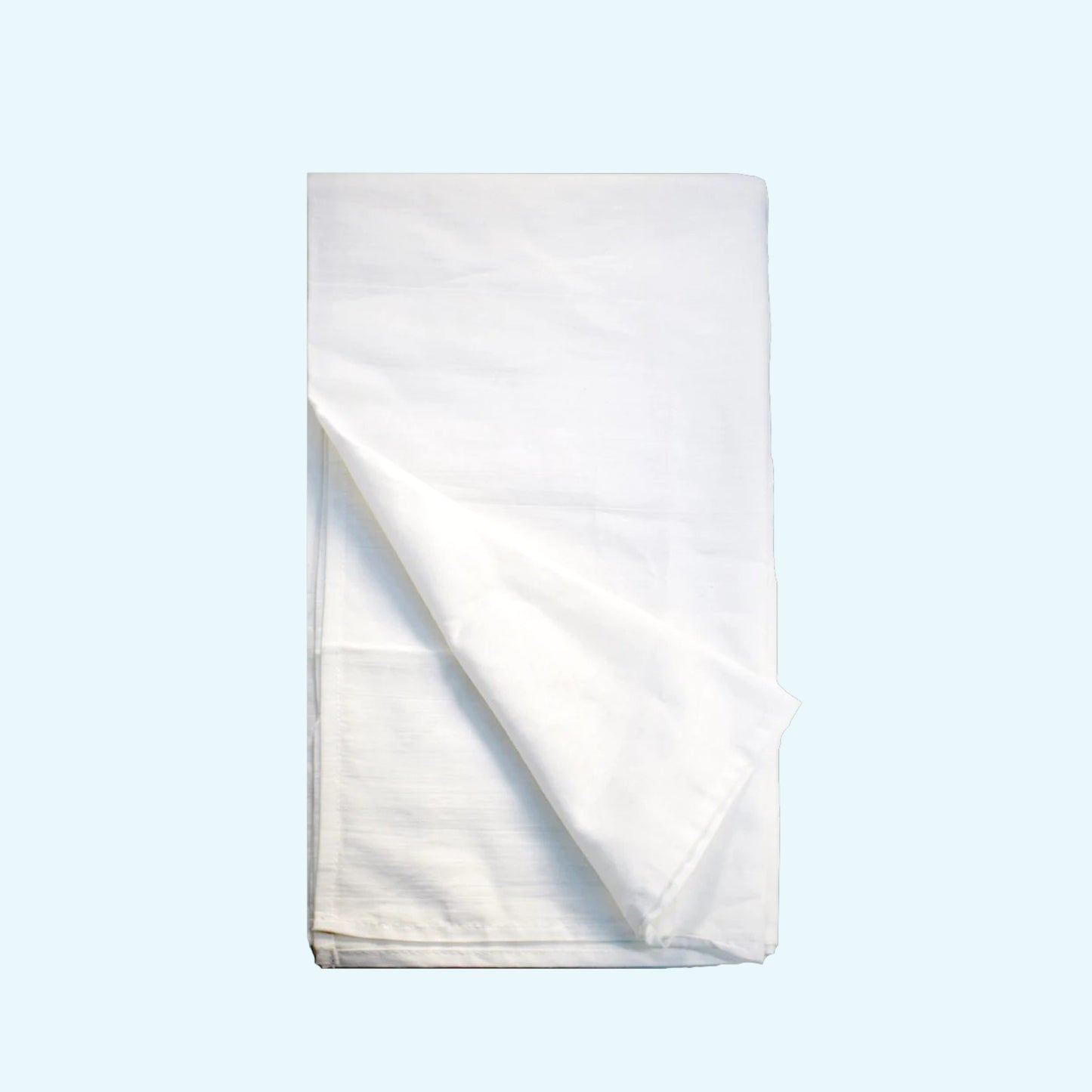 White folded towel on a light blue background