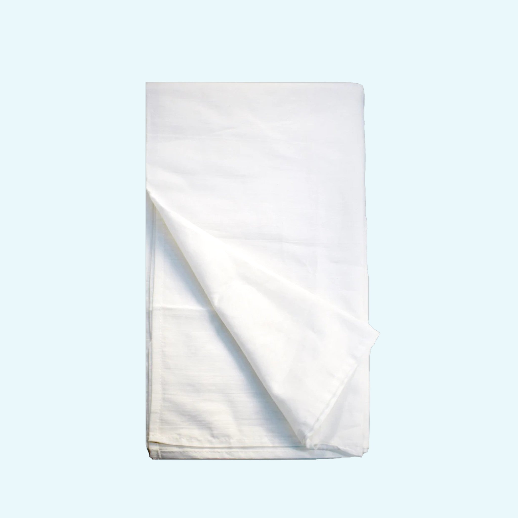 White folded towel on a light blue background