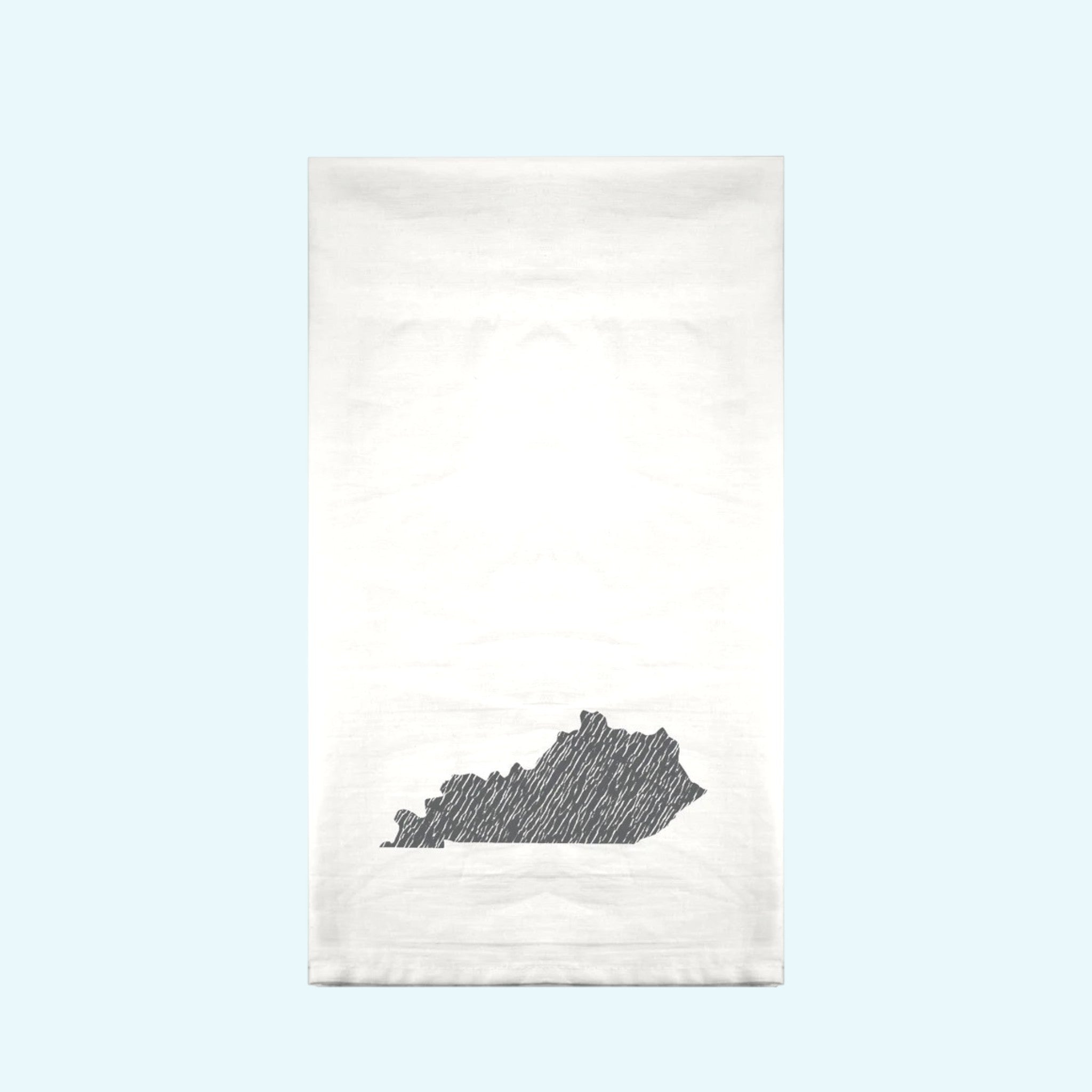 White towel with black state outline design on a gradient background