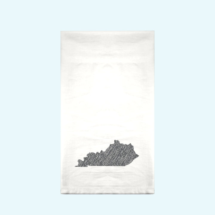 White towel with black state outline design on a gradient background