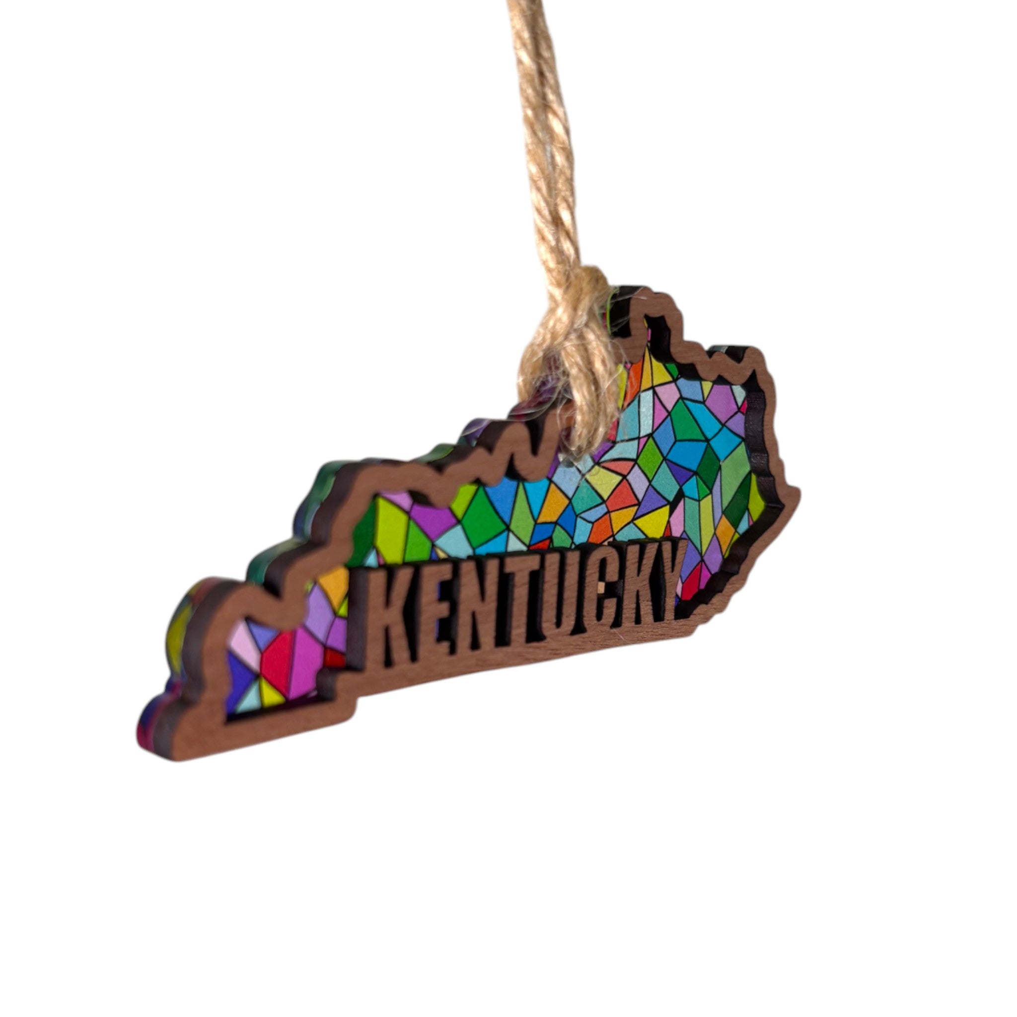 Decorative ornament shaped like the state of Kentucky with a colorful mosaic design on a white background.