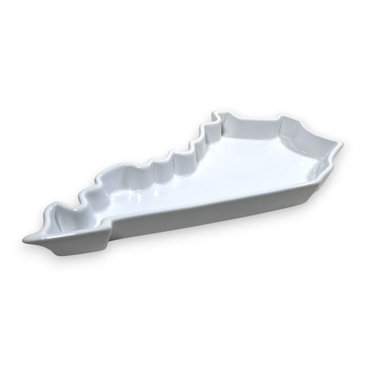 Side view of the white porcelain Kentucky State Plate, shaped like the state of Kentucky.