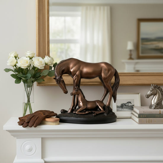 The large 12" x 11.5" Mom & Baby Horse Sculpture making a statement on a fireplace mantel.