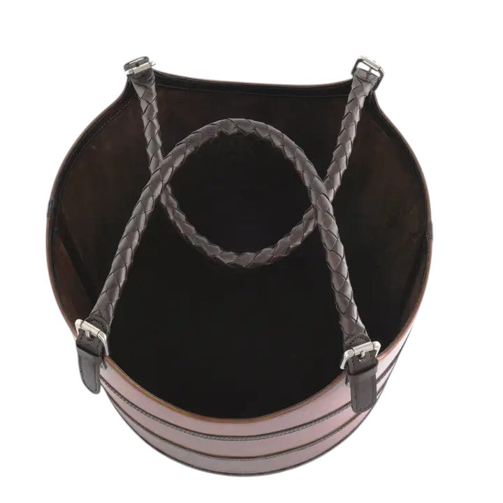 Black leather bag with braided handle on a white background