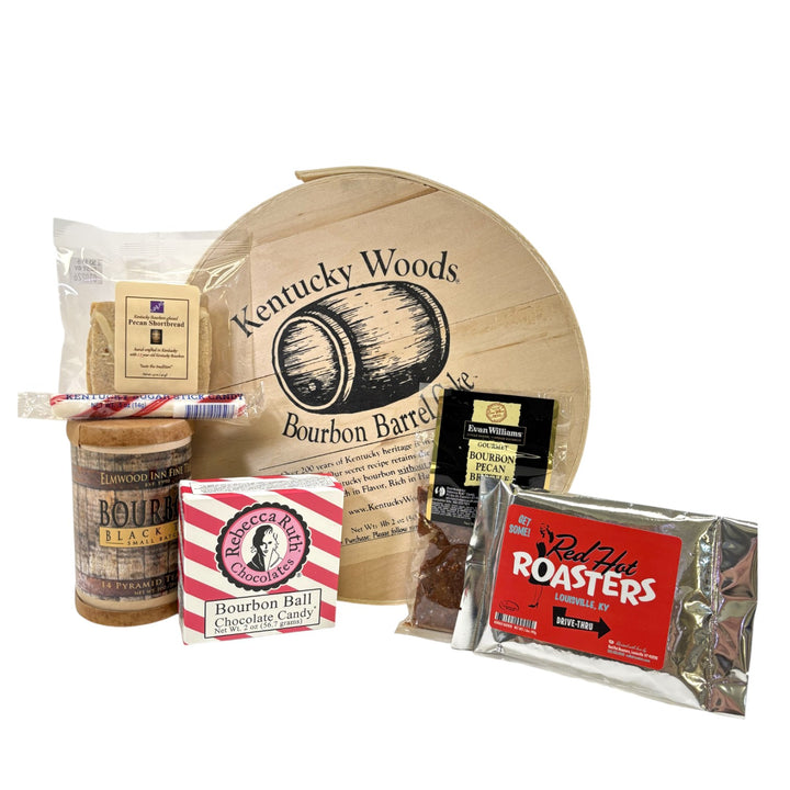 The Let Them Eat Bourbon Gift Set, featuring a Bourbon Barrel Cake, chocolates, tea, and other Kentucky bourbon-themed treats.
