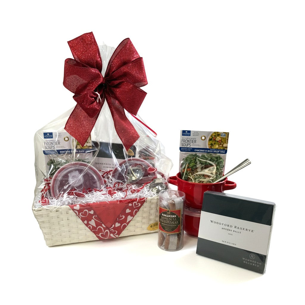 The Let's Stay In Basket featuring soup bowls, spoons, mix, and Kentucky sweets beautifully arranged.