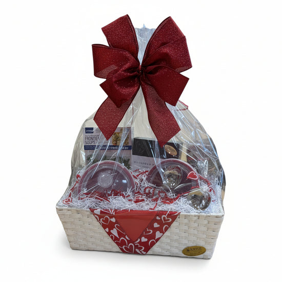 The Let's Stay In Basket featuring soup bowls, spoons, mix, and Kentucky sweets beautifully arranged.