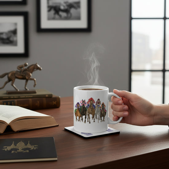 The Art of the Derby set featuring a white ceramic mug with a colorful horse racing illustration and a matching 152nd Kentucky Derby coaster.