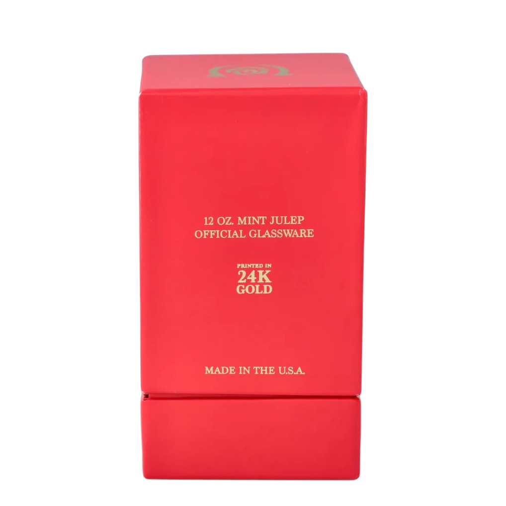 The limited edition gold julep glass shown next to its official packaging, perfect for gifting.