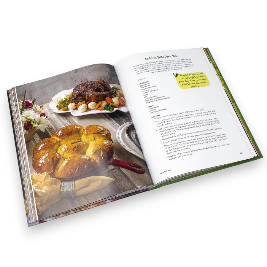 Open cookbook showing a recipe with images of roasted meat and bread on a white background