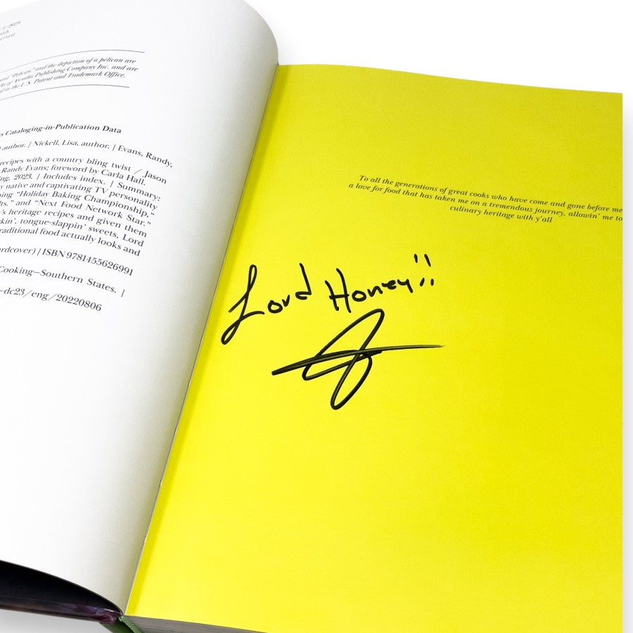 Open book with a yellow page featuring a handwritten message and signature.