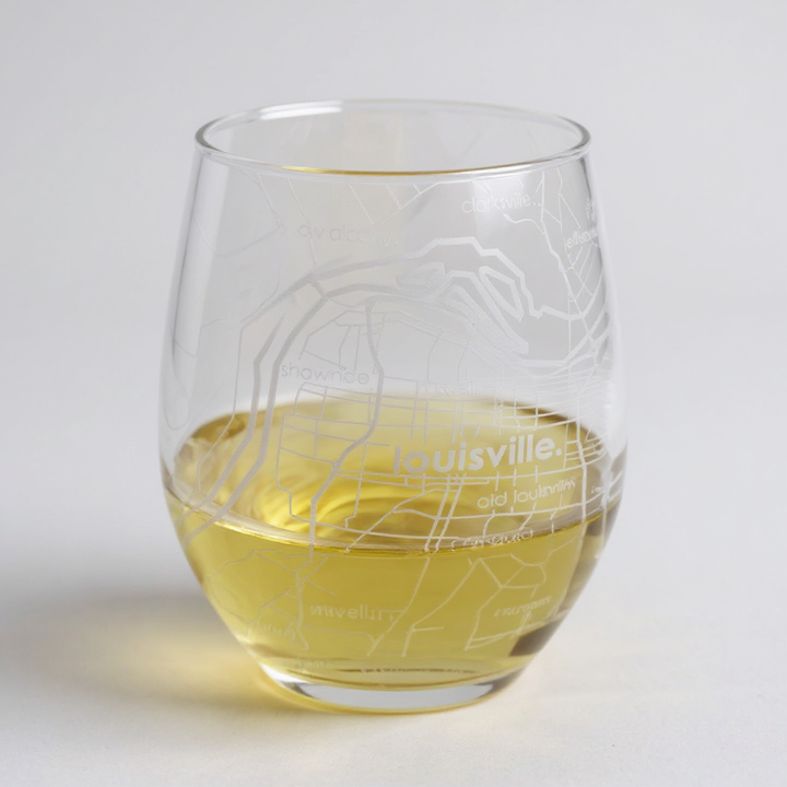 Front view of the 15 oz. stemless wine glass showing the etched Louisville city map.