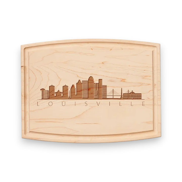 A front view of the "Skyline Louisville" Arched Artisan Maple Board, showcasing the detailed city skyline artwork and rich wood grain.