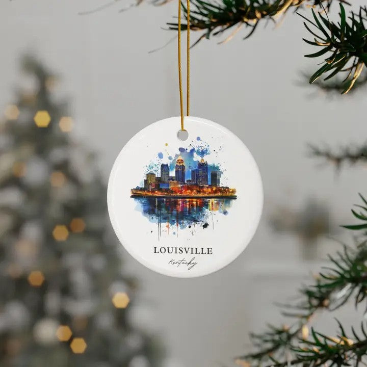 The Louisville skyline watercolor ornament hanging on a festive Christmas tree branch.