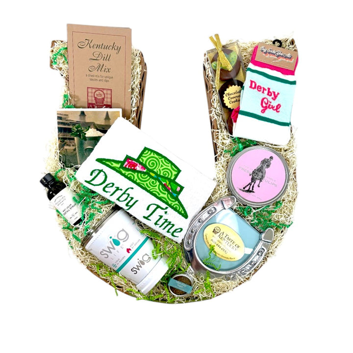 Top-down view showcasing all the genuine Kentucky heritage items included in the horseshoe gift basket.