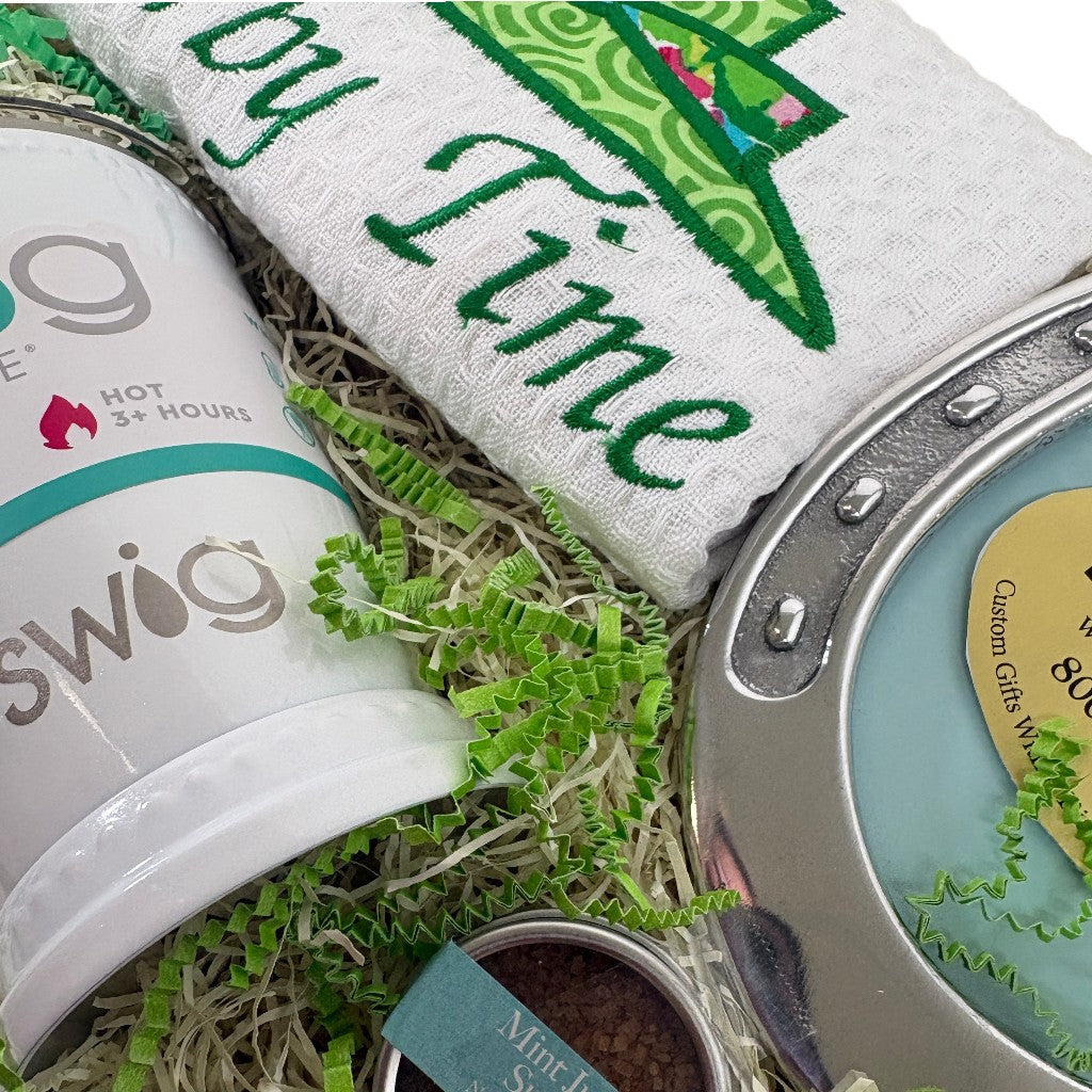Product display with 'Swig' mug, towel, and decorative item on a textured surface.