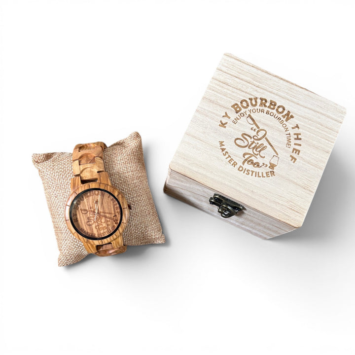 Master Distiller Bourbon Watch The Thief with a natural wooden barrel face, rose gold hands, and engraved Kentucky bourbon dial.