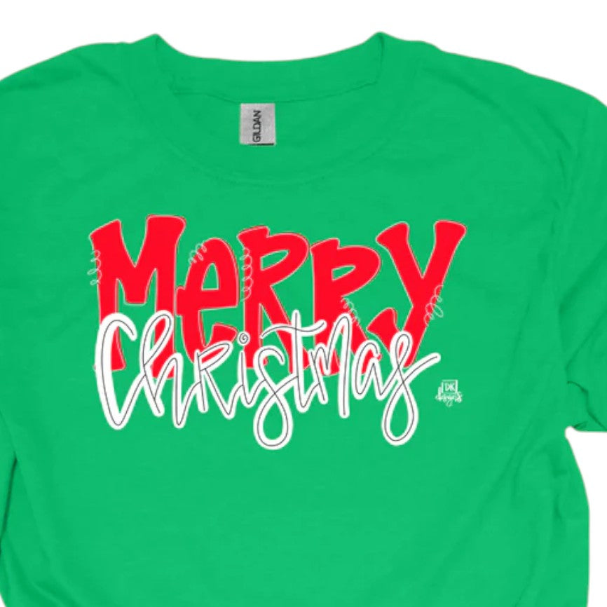 A close-up of the "MERRY Christmas" graphic on a green t-shirt, showing the baseball-style font.