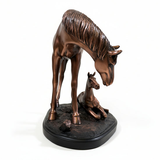 A front view showing the rich copper texture and heartwarming design of the mother and foal sculpture.