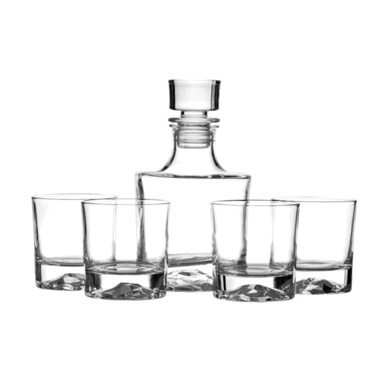 The complete whiskey decanter and four-glass set, showcasing the unique mountain design in the base of each piece.