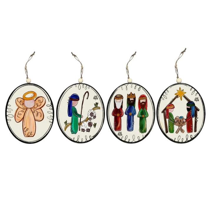 A set of four oval Nativity ornaments showing the Angel, Shepherd, Wise Men, and Holy Family.