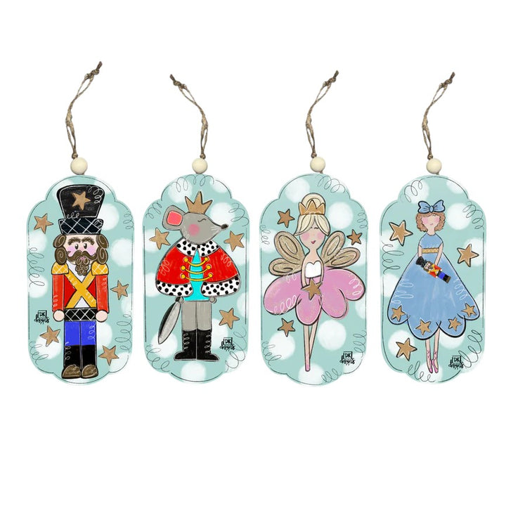 A set of four Nutcracker ballet ornaments featuring the main characters, on a white background.