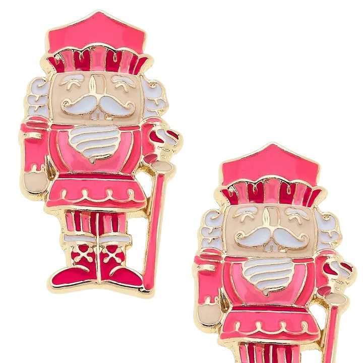 Pair of pink and gold nutcracker earrings on a white background