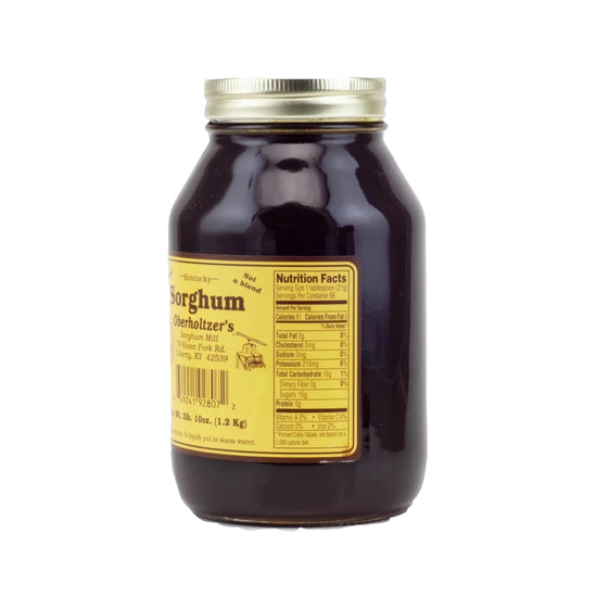 Jar of sorghum with a label on a white background