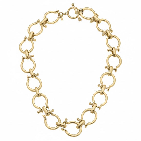 A close-up view of the classic and secure gold-tone toggle clasp.