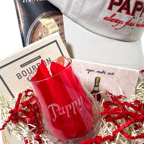 A close-up of the official Pappy Van Winkle tasting glass included in the set.