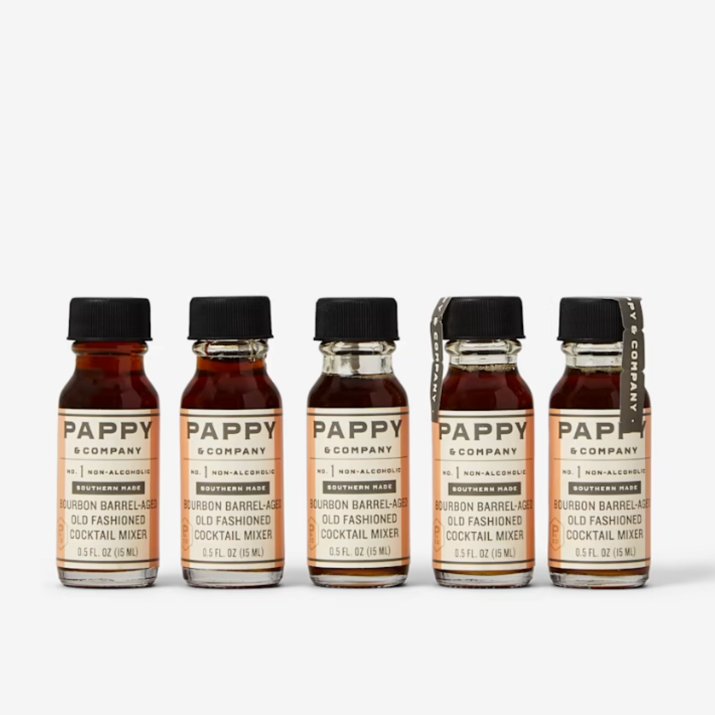 Five bottles of Pappy & Company cocktail mixers on a white background