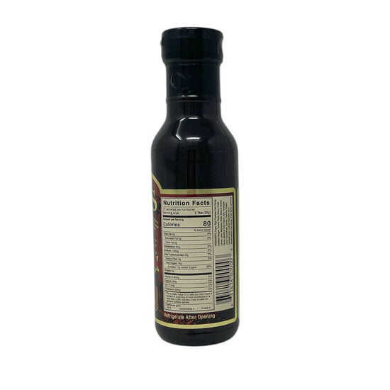 Bottle of syrup with nutrition facts label on a white background
